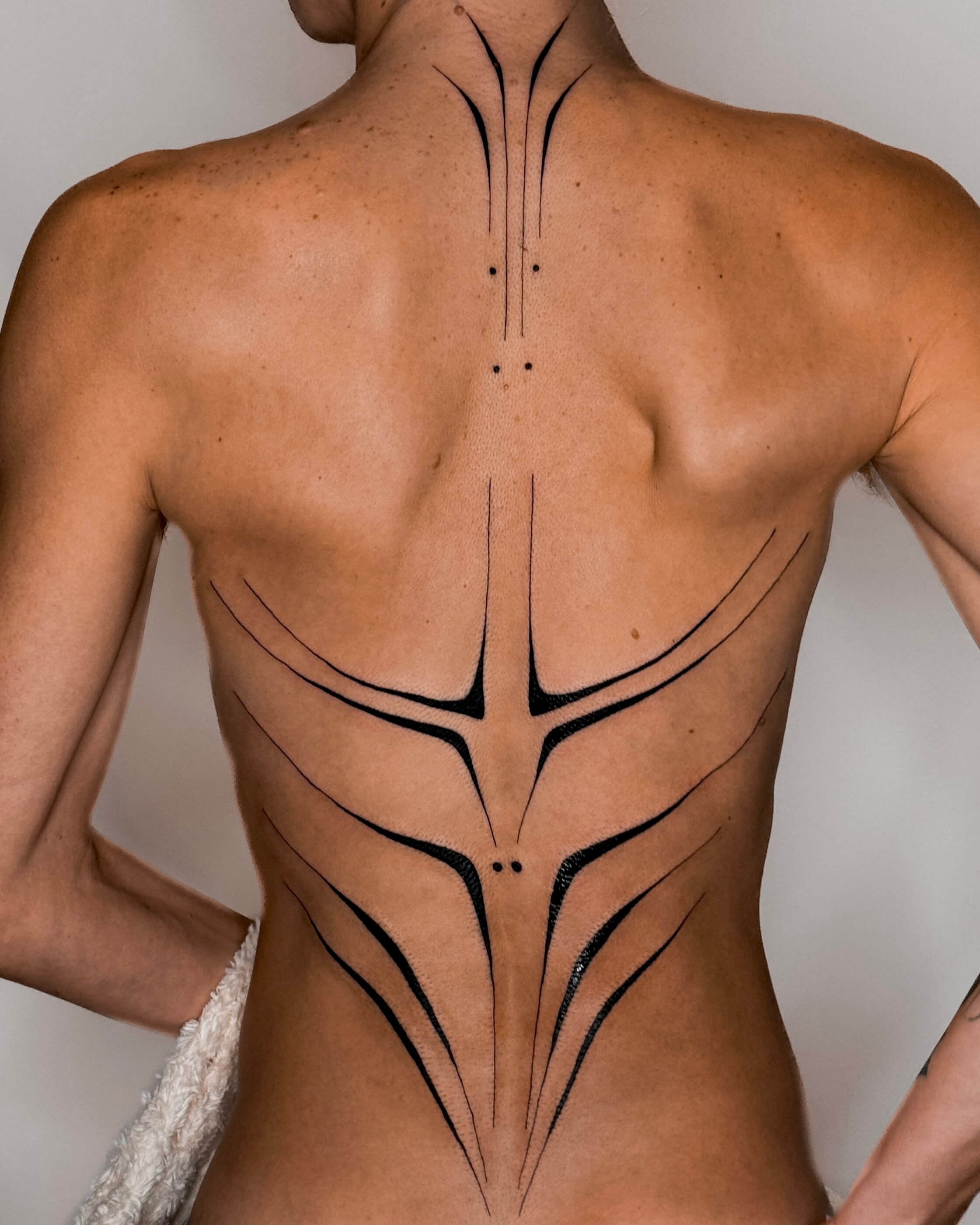 Blackwork abstract tattoo on the back