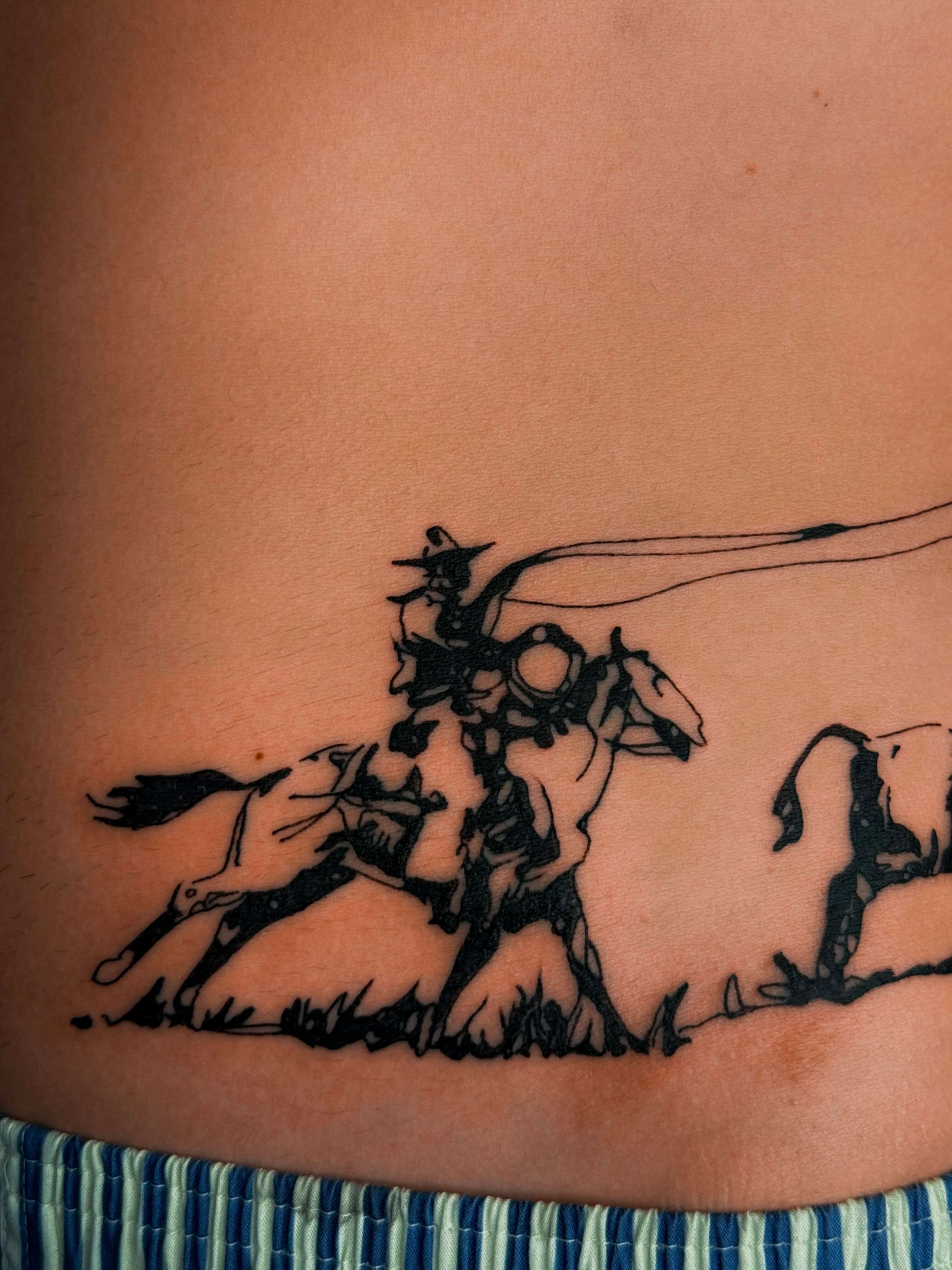 Blackwork tattoo, lower abdomen, horse riders motif, Valencia