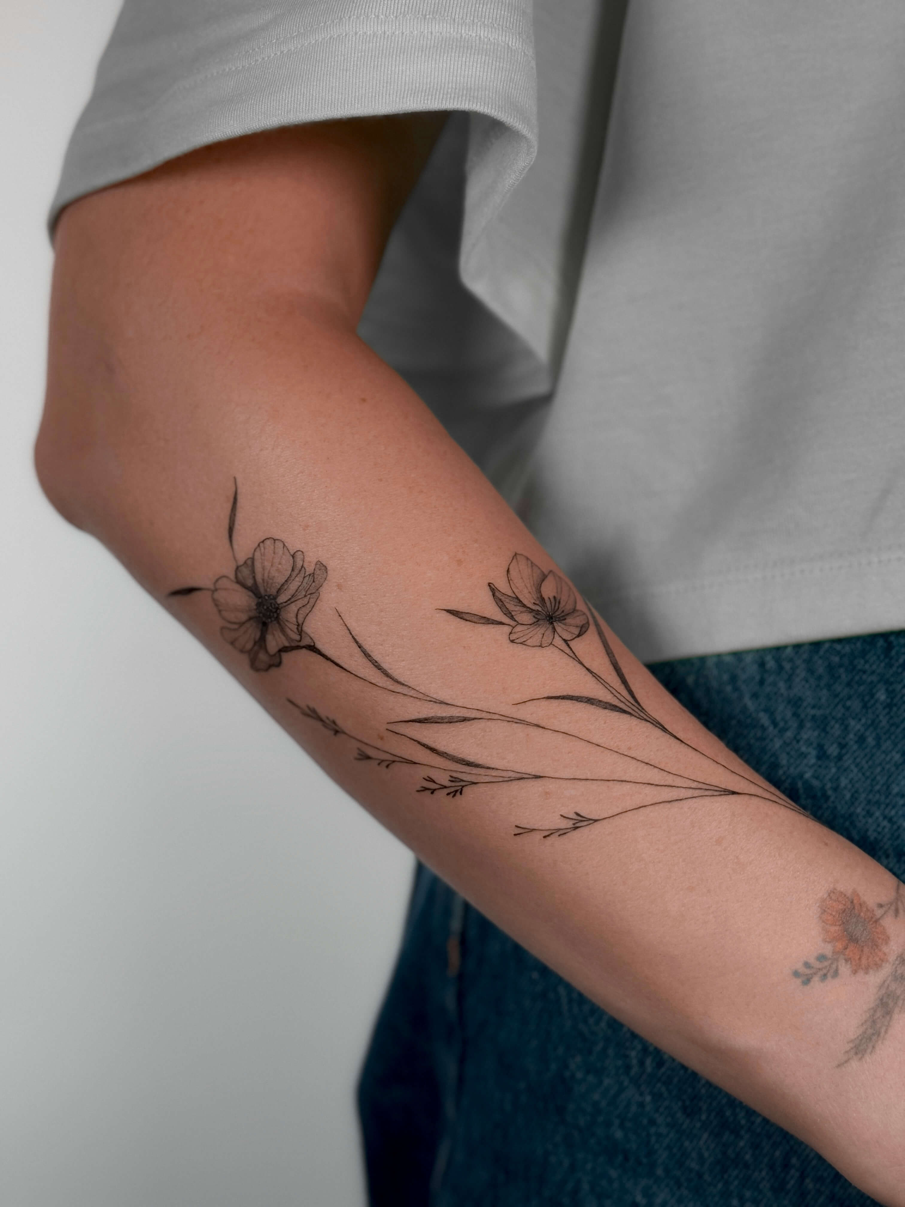 Botanical poppy flower tattoo