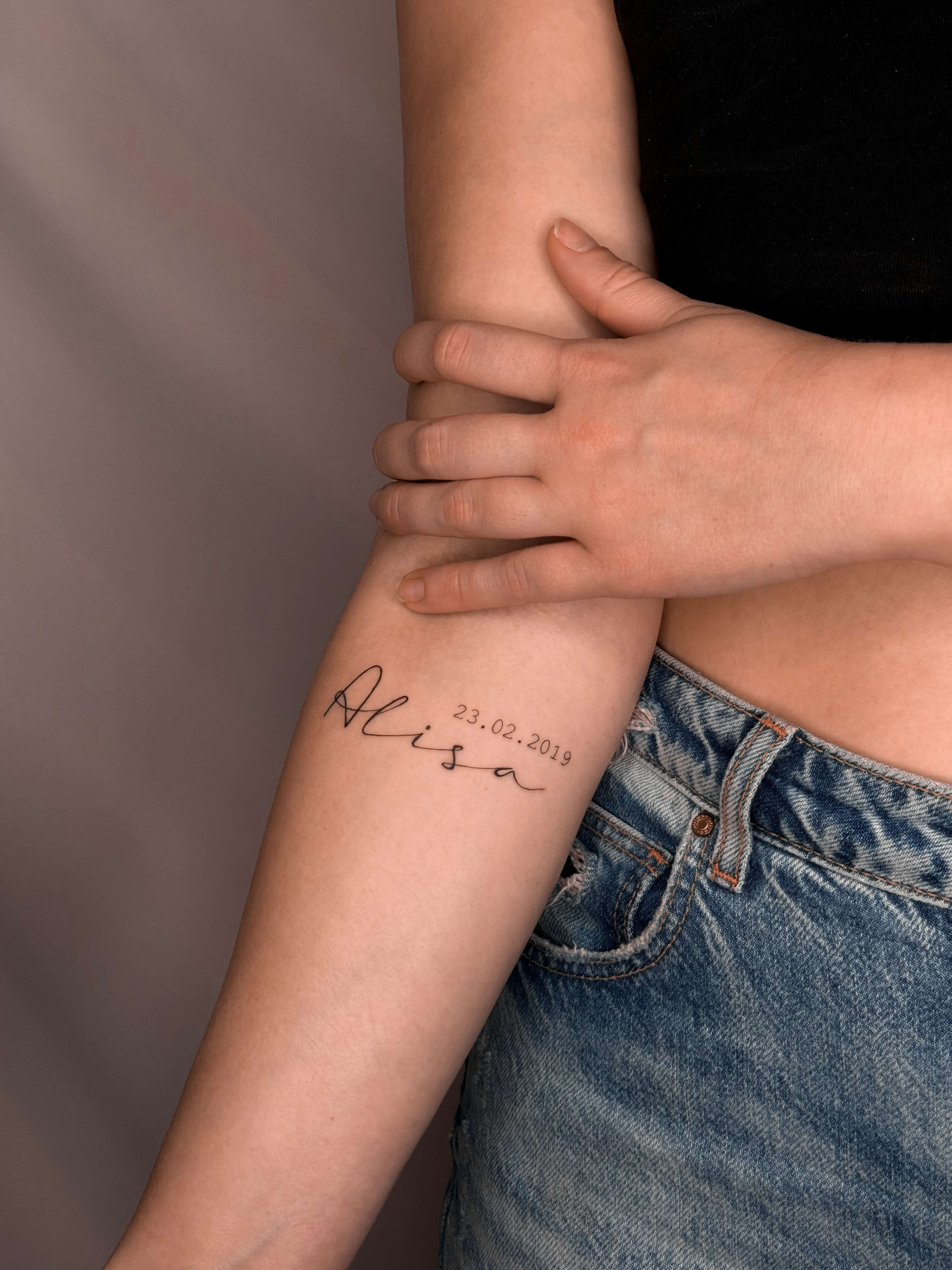 Fine line name tattoo